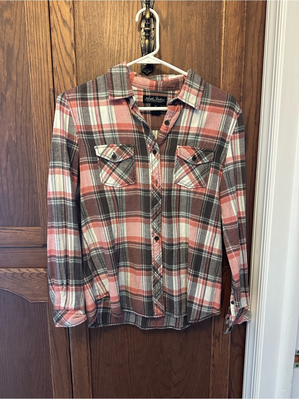 Grey and salmon color plaid shirt.